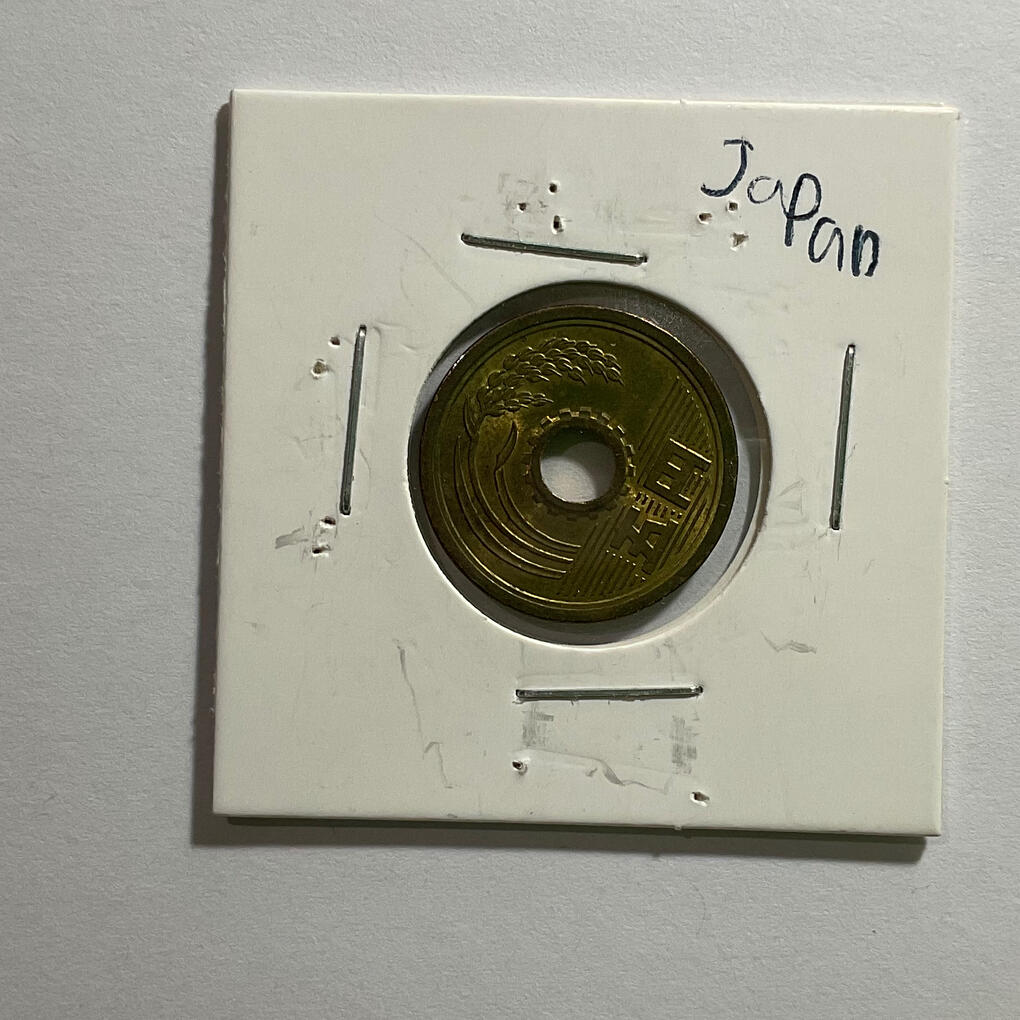 Japanese coin with a hole in it